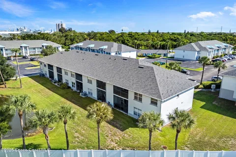 a aerial view of a house with a big yard