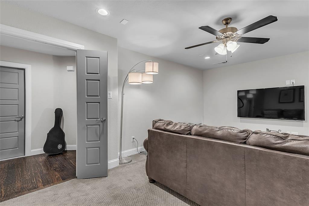 1014 Rennard Street Caddo Mills, TX 75135 - Photo 30 of 39 Upstairs bonus room wired for surround sound featuring recessed lighting, ceiling fan, paneled doors, carpet, neutral paint and walk-in access to attic with subfloor. Could easily be a guest quarters, media or game room.