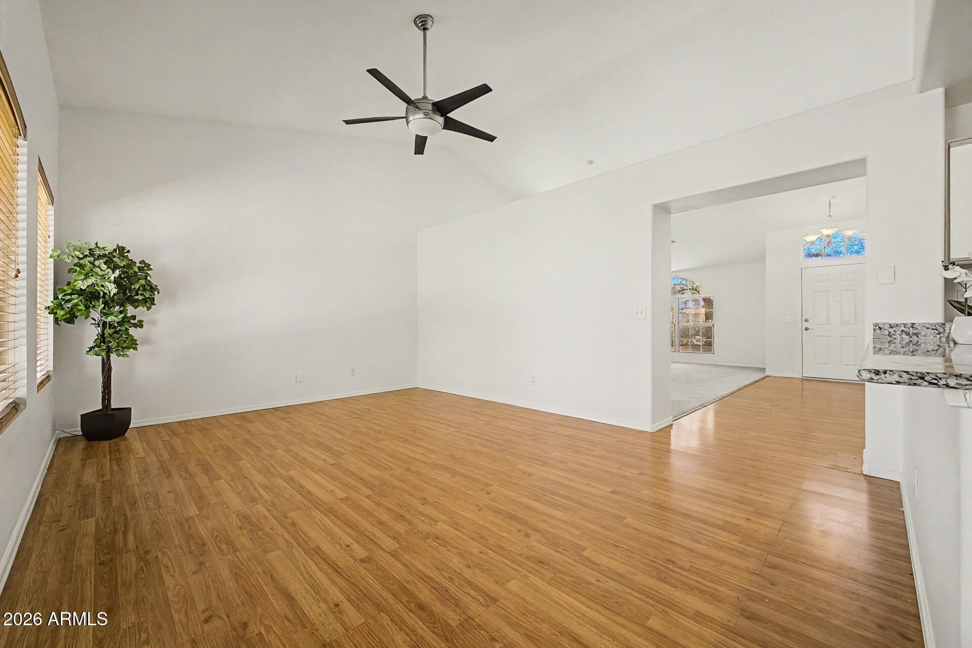 2762 North Ricardo Mesa, AZ 85215 - Photo 12 of 38 a view of empty room with wooden floor and potted plant