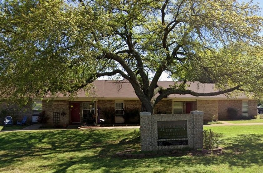 1600 East Murchison Street Palestine, TX 75801 - Photo 2 of 8 a front view of a house with garden