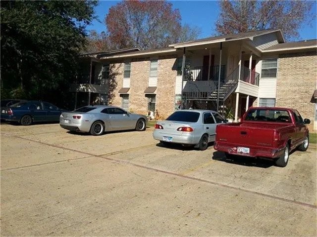 1600 East Murchison Street Palestine, TX 75801 - Photo 4 of 8 a car parked in front of a house