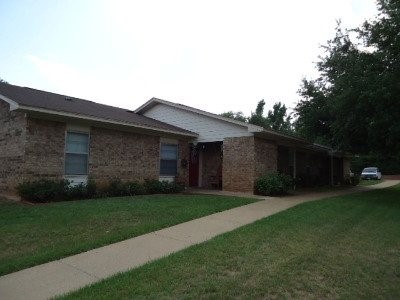 1600 East Murchison Street Palestine, TX 75801 - Photo 8 of 8 a front view of a house with a garden