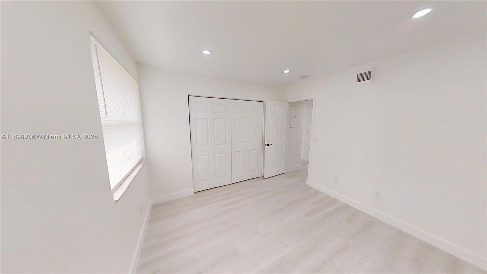 20230 Northeast 3rd Court, Unit 6 Miami, FL 33179 - Photo 22 of 44 a view of an empty room