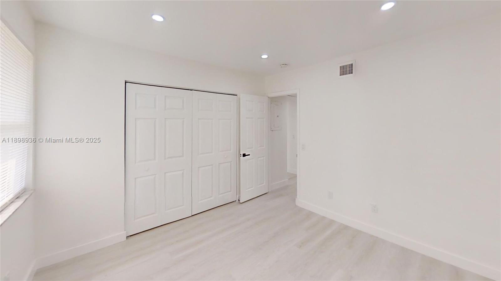 20230 Northeast 3rd Court, Unit 6 Miami, FL 33179 - Photo 23 of 44 a view of an empty room