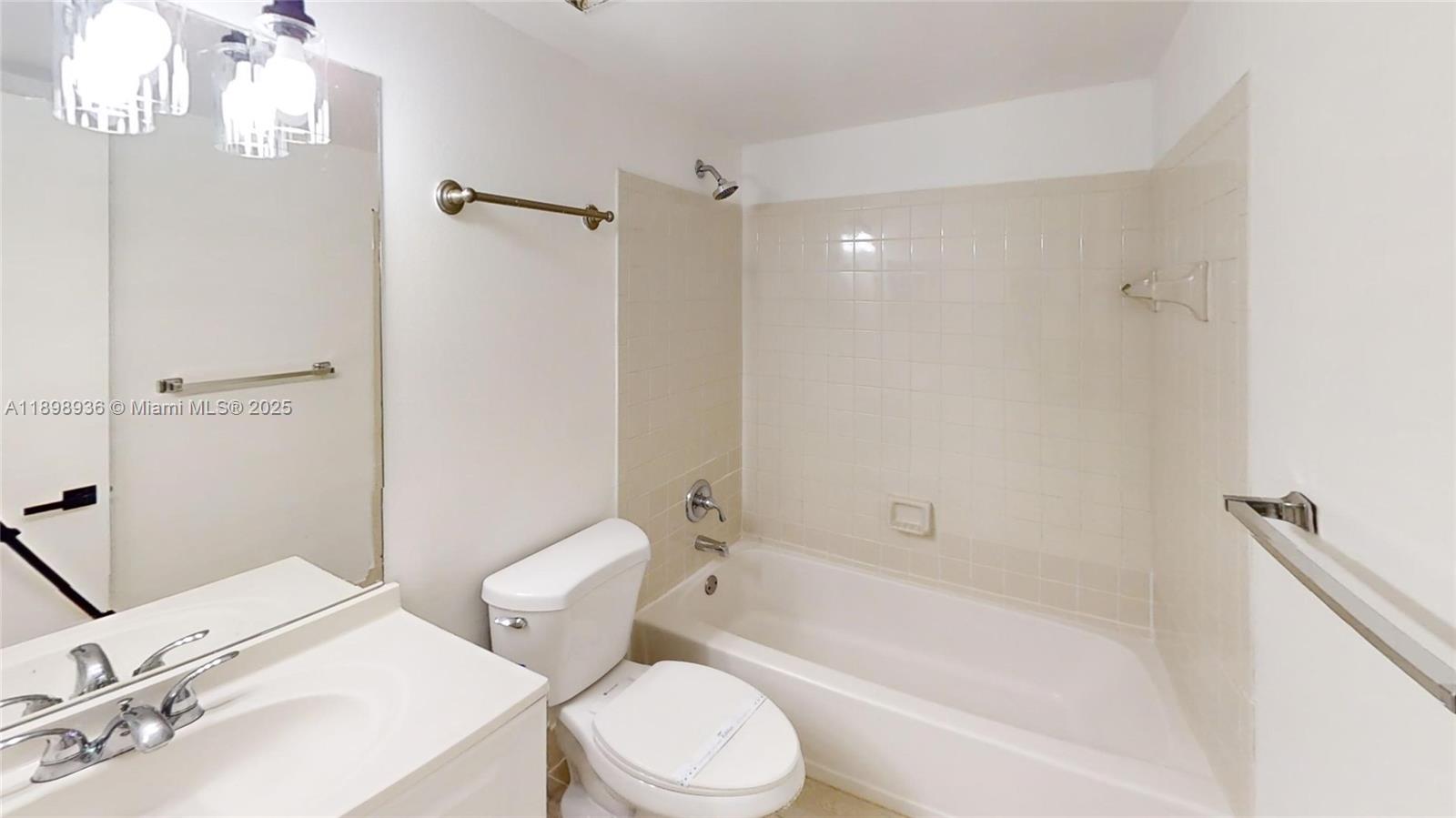 20230 Northeast 3rd Court, Unit 6 Miami, FL 33179 - Photo 24 of 44 a bathroom with a sink toilet and shower