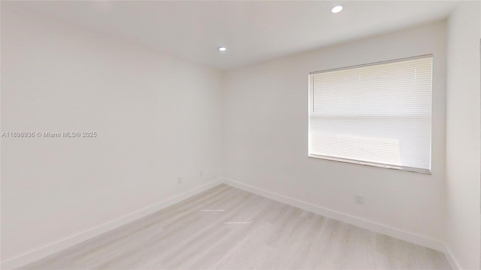 20230 Northeast 3rd Court, Unit 6 Miami, FL 33179 - Photo 27 of 44 a view of a small space with a window