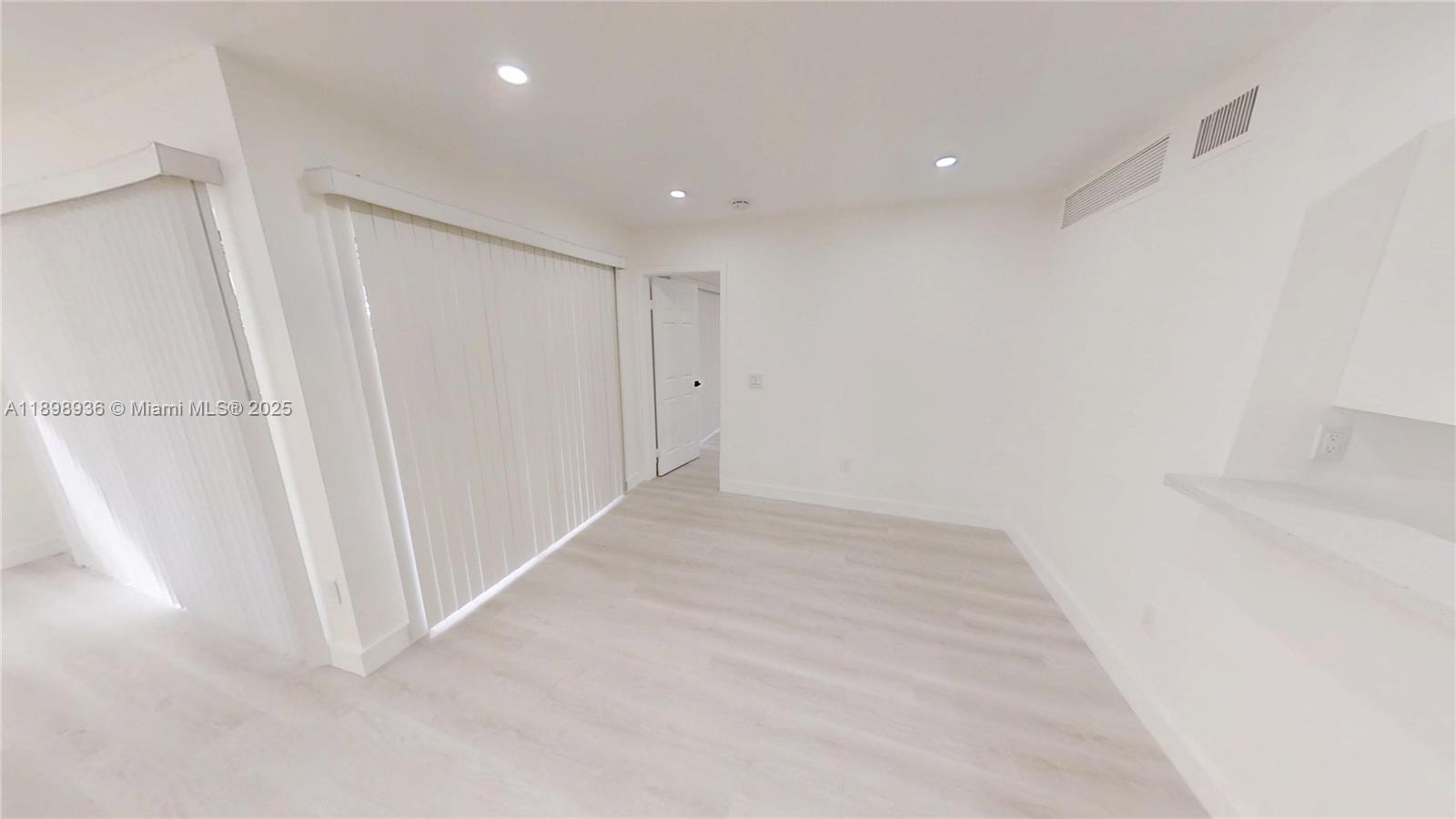 20230 Northeast 3rd Court, Unit 6 Miami, FL 33179 - Photo 28 of 44 a view of a hallway