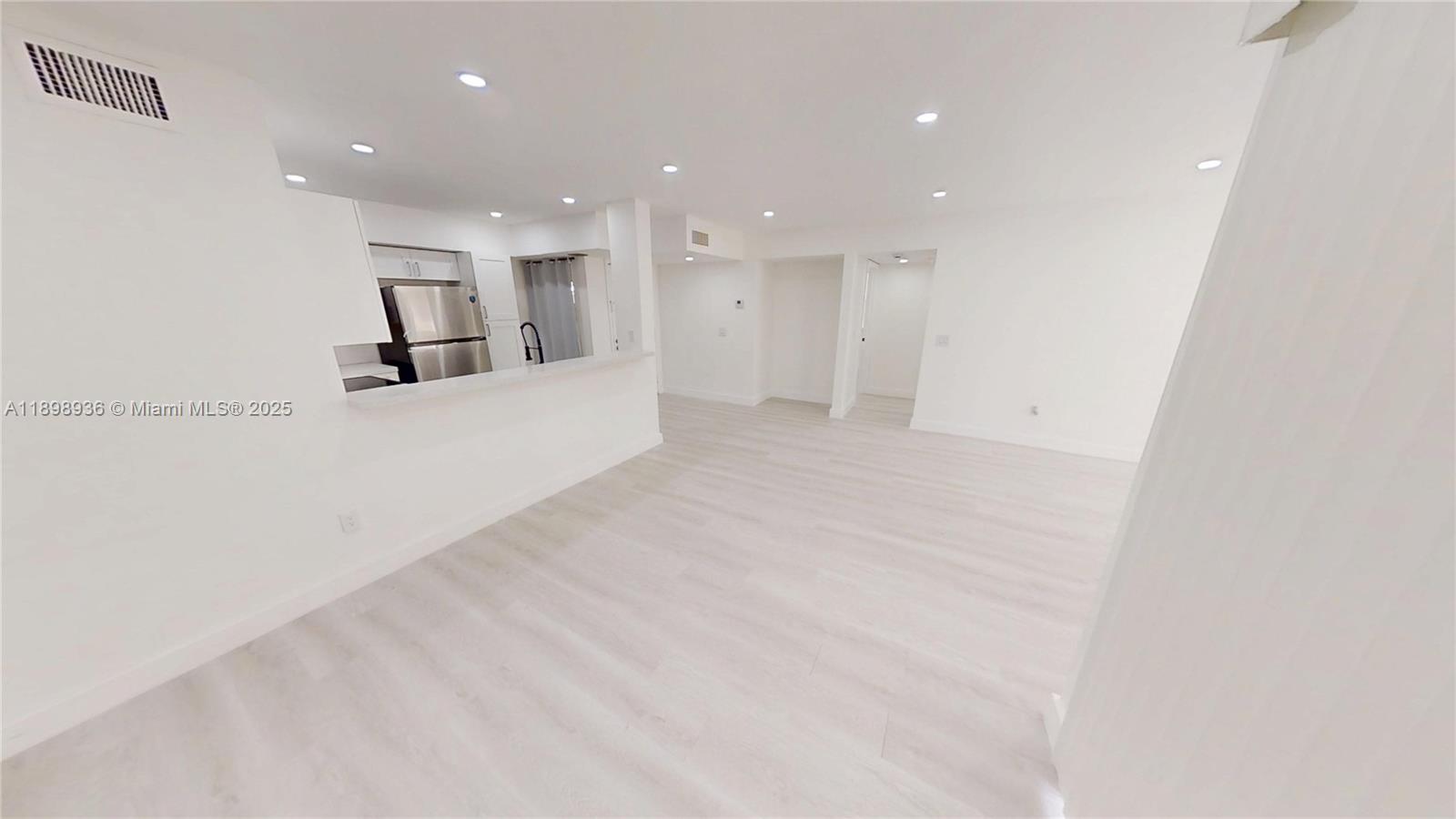 20230 Northeast 3rd Court, Unit 6 Miami, FL 33179 - Photo 32 of 44 a view of a big room with kitchen and windows