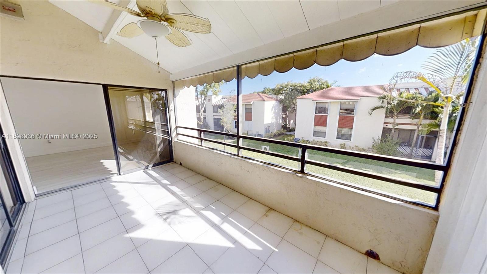20230 Northeast 3rd Court, Unit 6 Miami, FL 33179 - Photo 33 of 44 a view of a living room with a large window