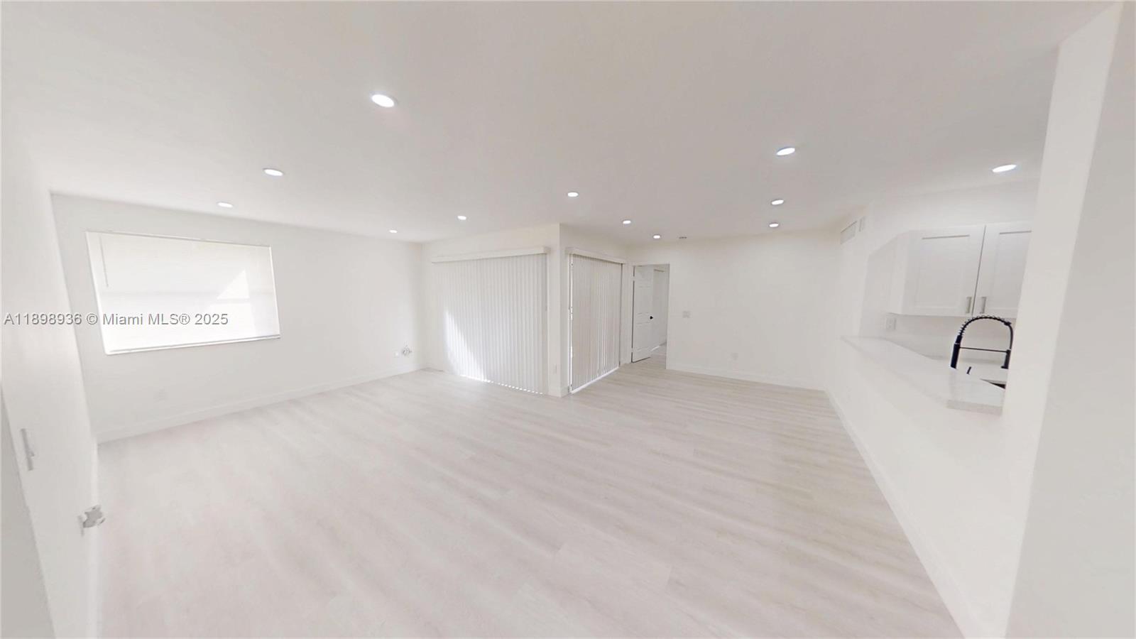 20230 Northeast 3rd Court, Unit 6 Miami, FL 33179 - Photo 4 of 44 a view of a kitchen with a sink and a refrigerator