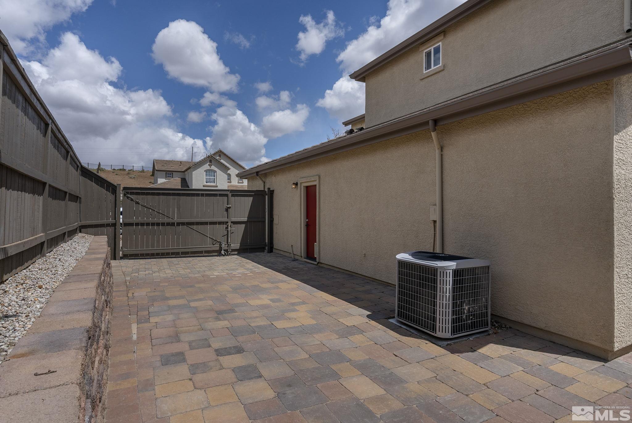 8065 Fire Opal Lane Reno, NV 89506 - Photo 11 of 31 a view of an empty room with a fireplace