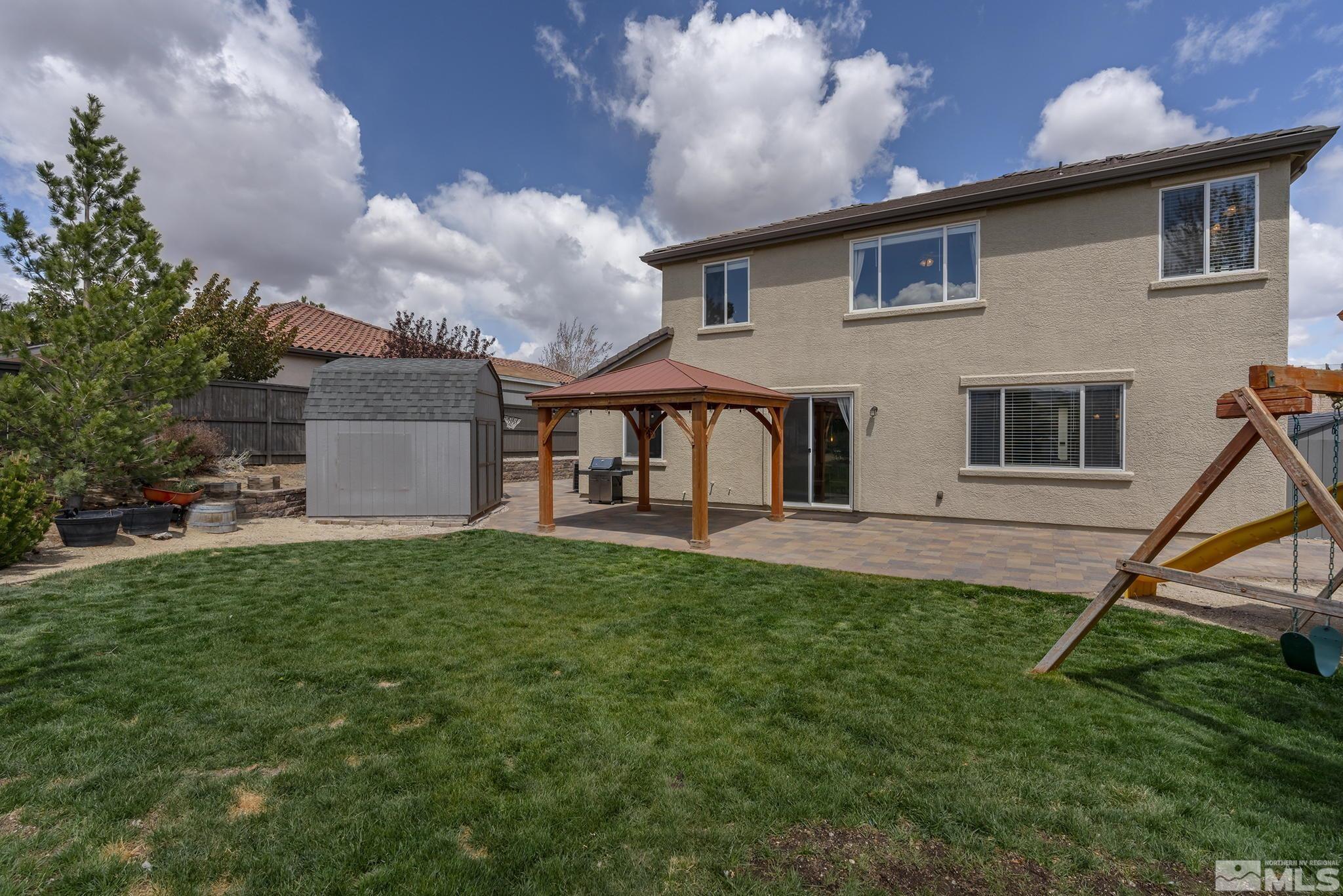 8065 Fire Opal Lane Reno, NV 89506 - Photo 12 of 31 a view of a house with a backyard