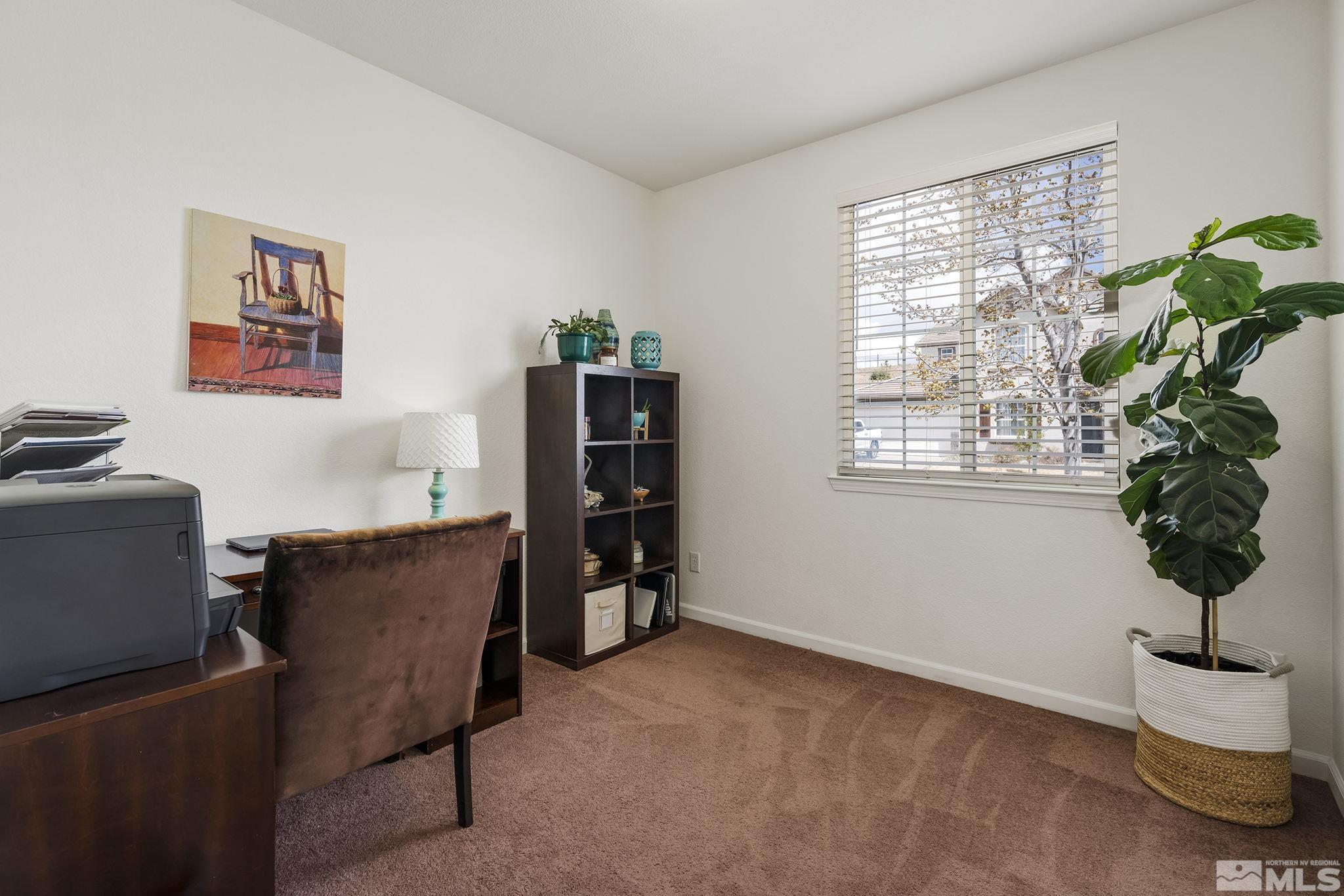 8065 Fire Opal Lane Reno, NV 89506 - Photo 14 of 31 a view of workspace with a window and potted plant