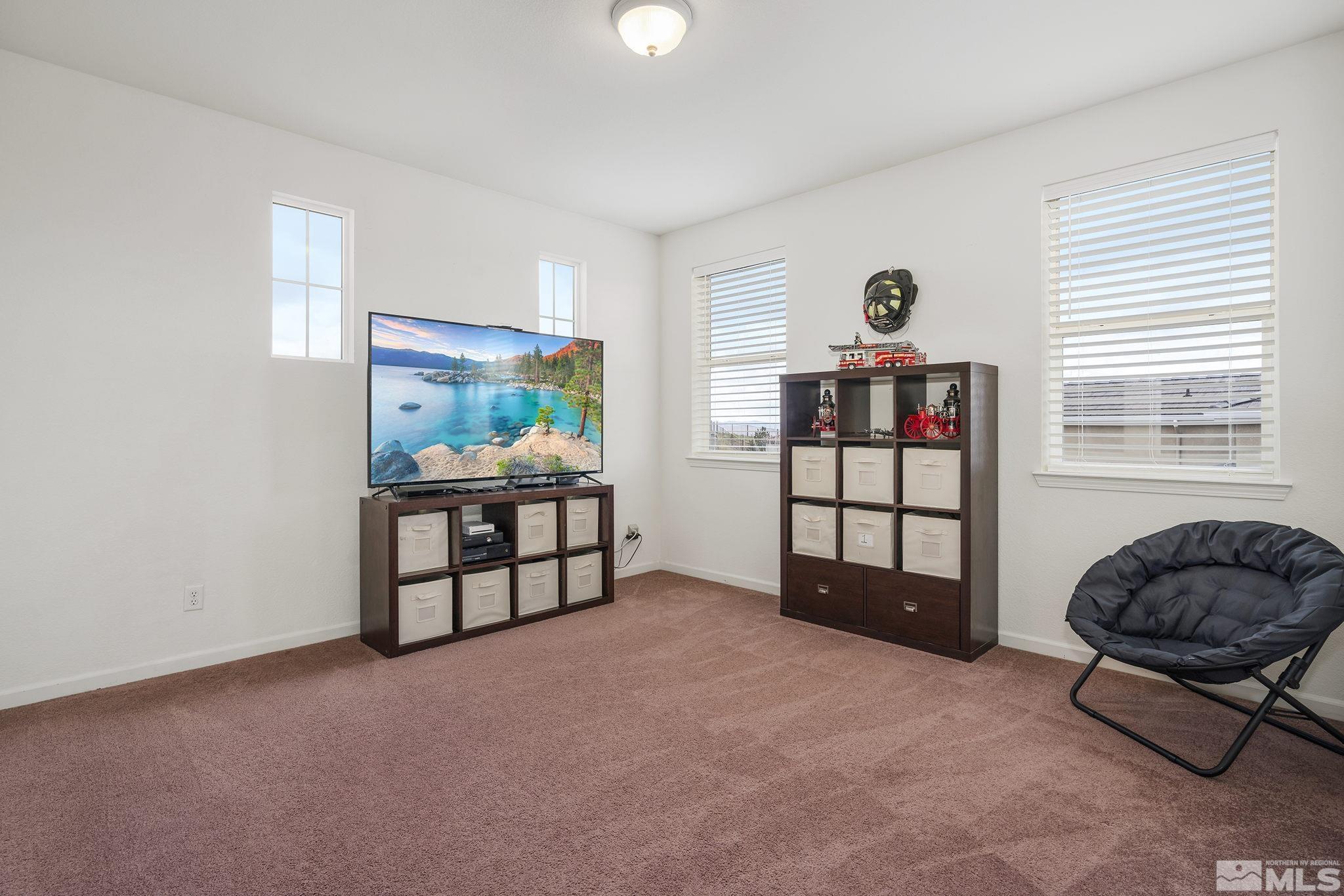 8065 Fire Opal Lane Reno, NV 89506 - Photo 18 of 31 a living room with furniture and a window
