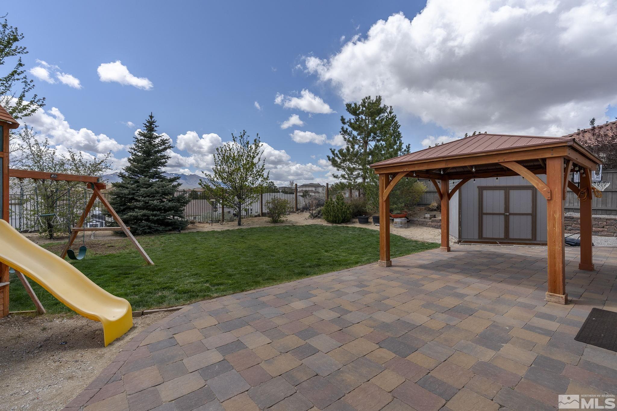 8065 Fire Opal Lane Reno, NV 89506 - Photo 29 of 31 a view of patio with a yard