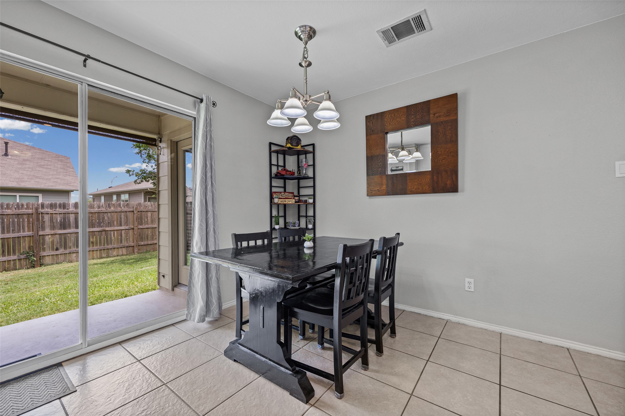 13501 Lismore Lane Pflugerville, TX 78660 - Photo 7 of 28 Oversized breakast area overlooking the covered back patio and fully fenced yard