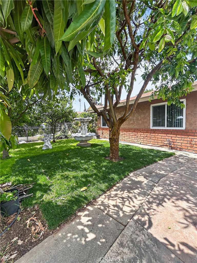 7451 Diamond Street Riverside, CA 92504 - Photo 27 of 31 a front view of a house with garden