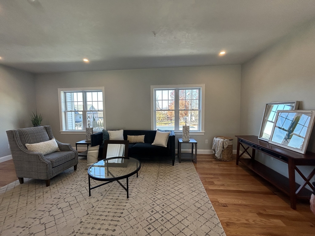 10 Windsor Street, Unit B Worcester, MA 01605 - Photo 3 of 38 a living room with furniture and a window