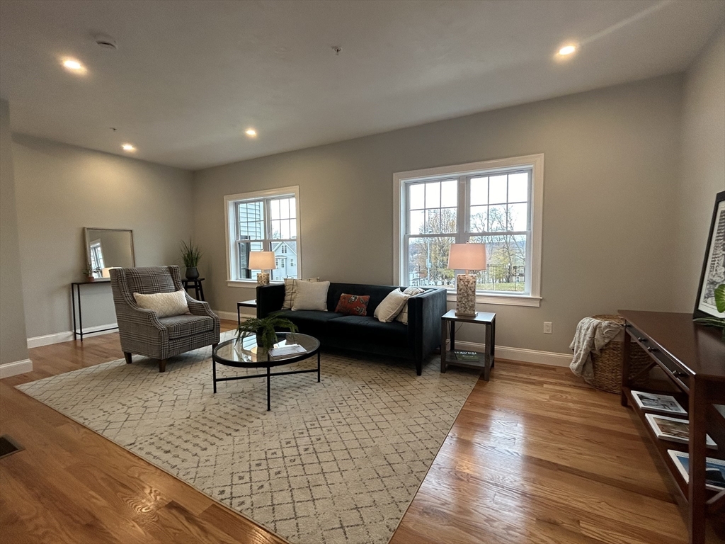 10 Windsor Street, Unit B Worcester, MA 01605 - Photo 7 of 38 a living room with furniture and a couch