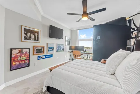 a bathroom with a granite countertop sink mirror and a bathtub