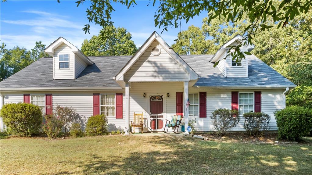 164 Mountain Home Road Cedartown, GA 30125 - Photo 1 of 1 a front view of a house with a garden and tree