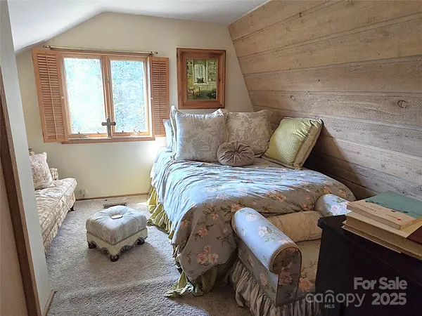 a bathroom with a toilet and bathtub