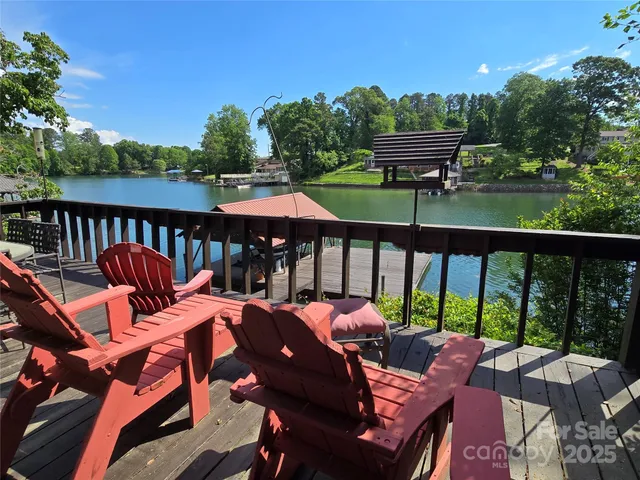 a view of a patio with a table chairs and a backyard