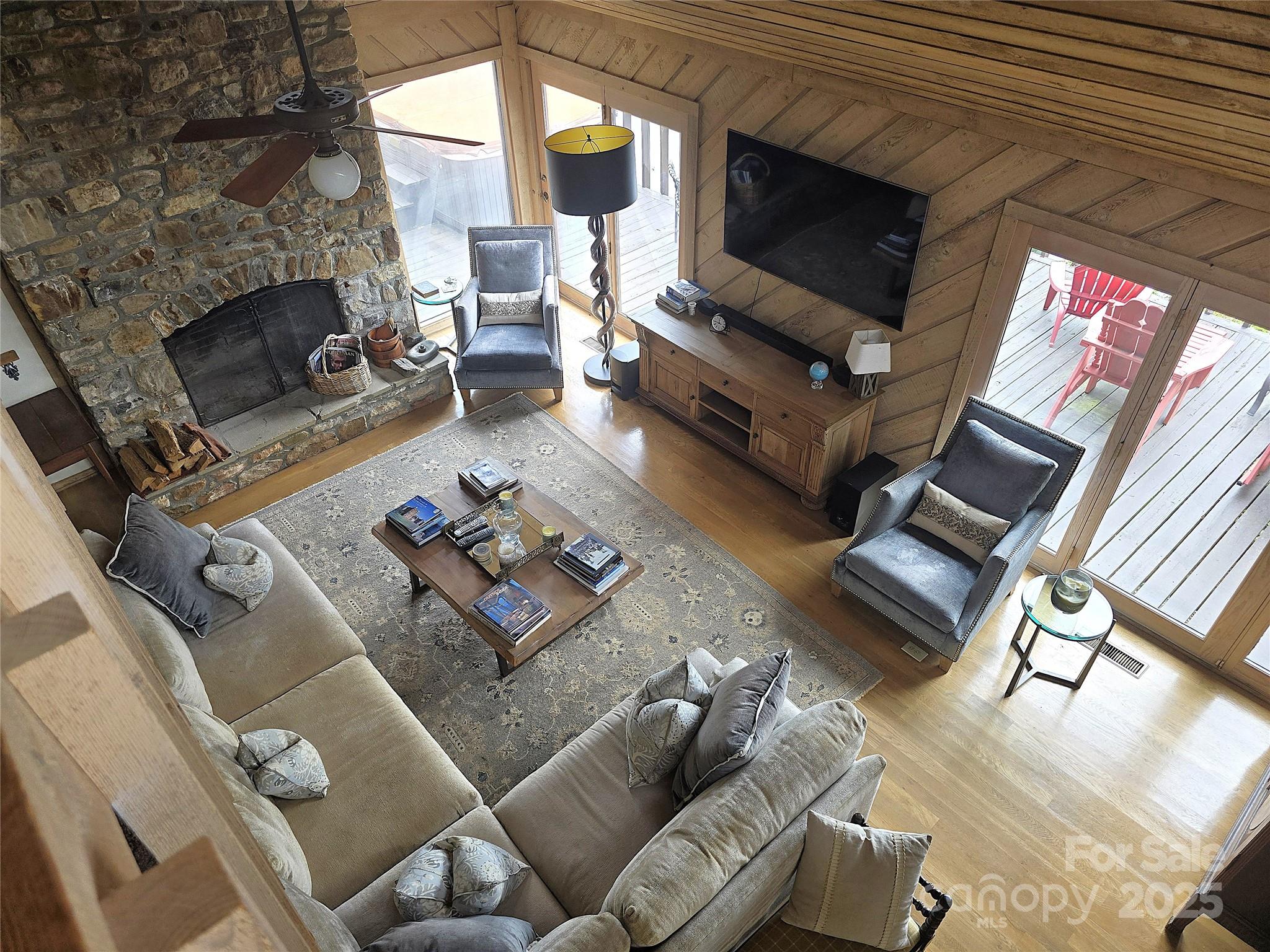 6580 Central Drive Conover, NC 28613 - Photo 24 of 27 a living room with furniture a fireplace and a flat screen tv