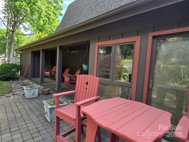 a table and chairs in front of a house