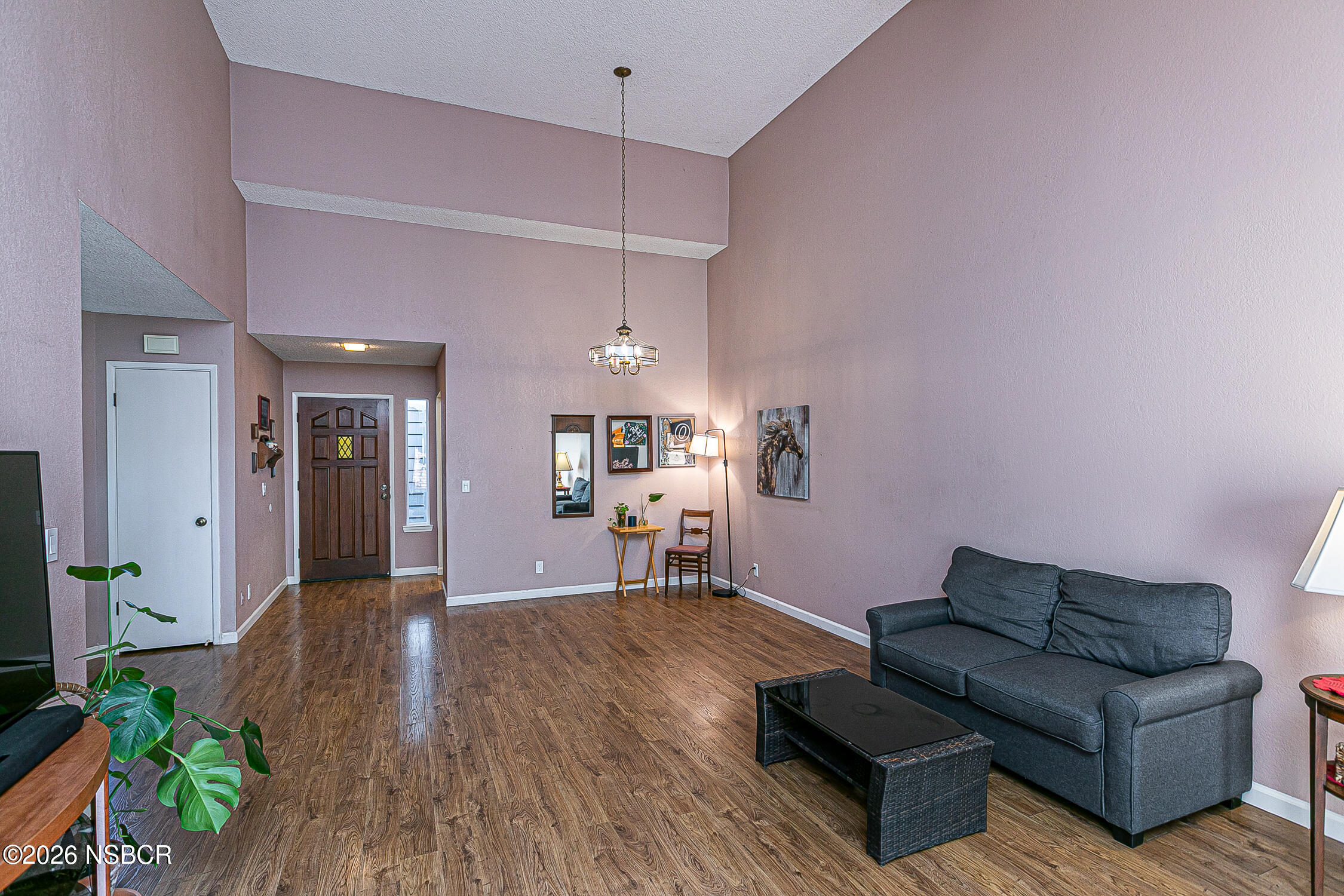1412 Oakridge Park Road Santa Maria, CA 93455 - Photo 7 of 35 a living room with furniture and a chandelier