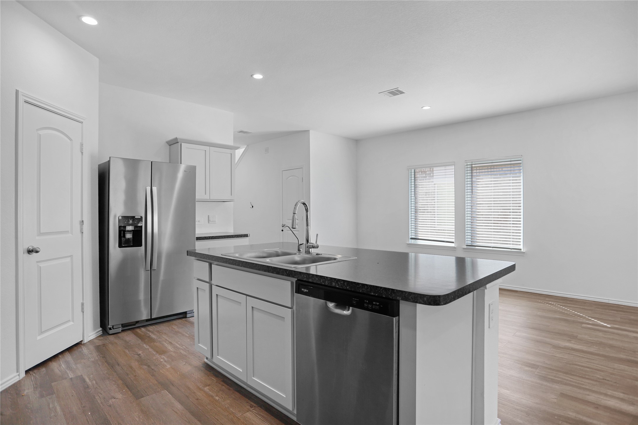 24311 Saddlestone Green Dr Spring Spring, TX 77373 - Photo 11 of 36 a kitchen with stainless steel appliances granite countertop a sink and refrigerator