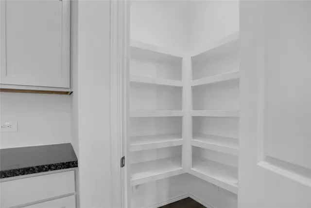 a room with walk in closet and a window