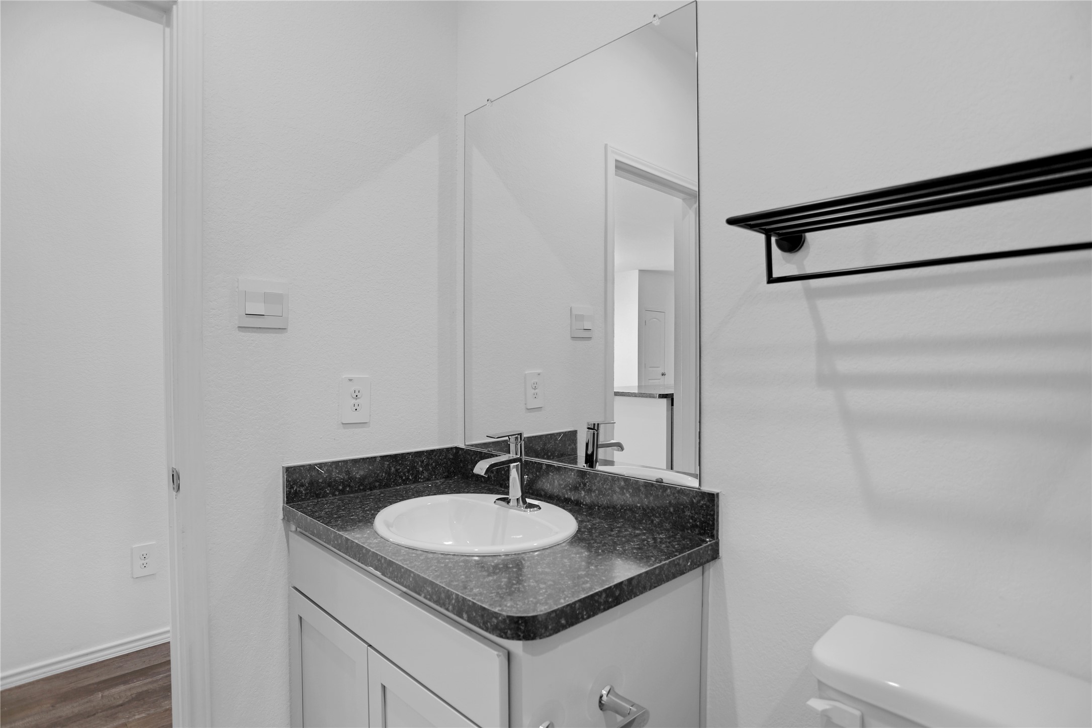 24311 Saddlestone Green Dr Spring Spring, TX 77373 - Photo 18 of 36 a bathroom with a granite countertop sink and a mirror