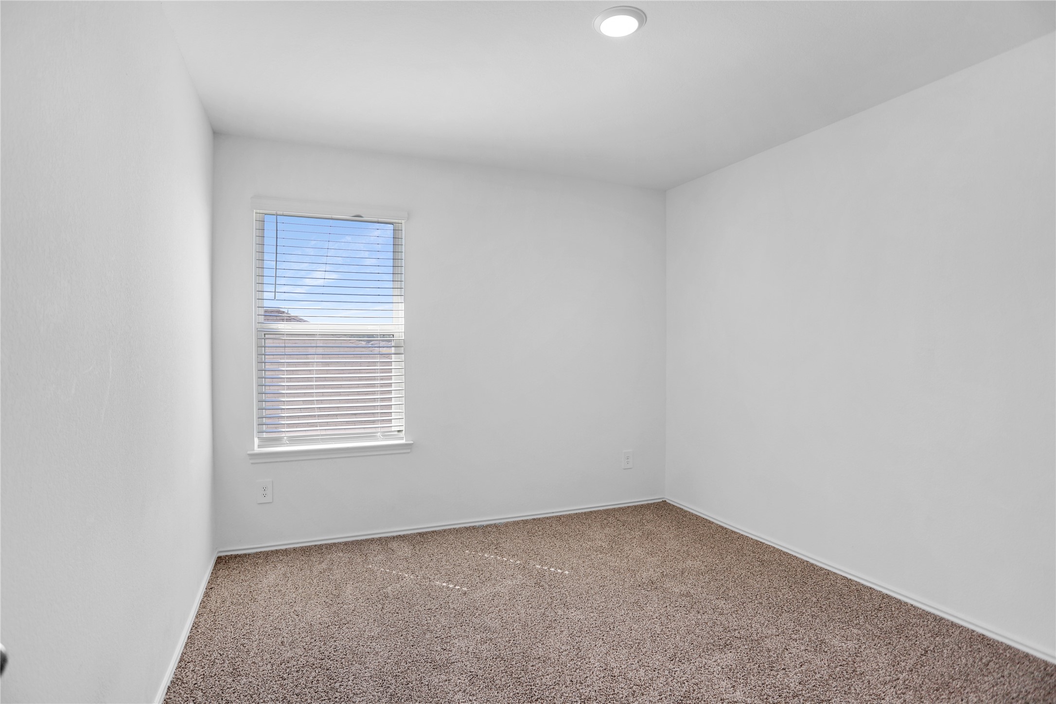 24311 Saddlestone Green Dr Spring Spring, TX 77373 - Photo 29 of 36 an empty room with a window