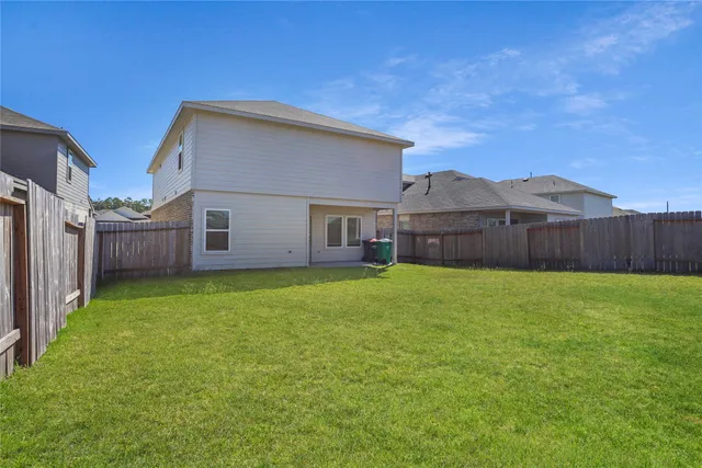 a view of a house with a back yard