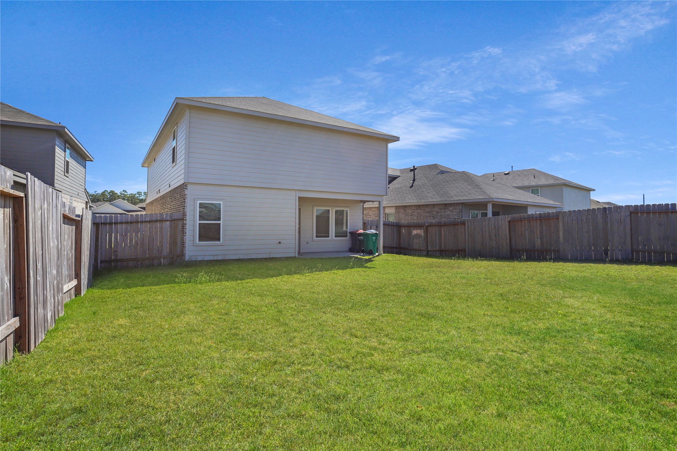 24311 Saddlestone Green Dr Spring Spring, TX 77373 - Photo 34 of 36 a view of a house with a back yard