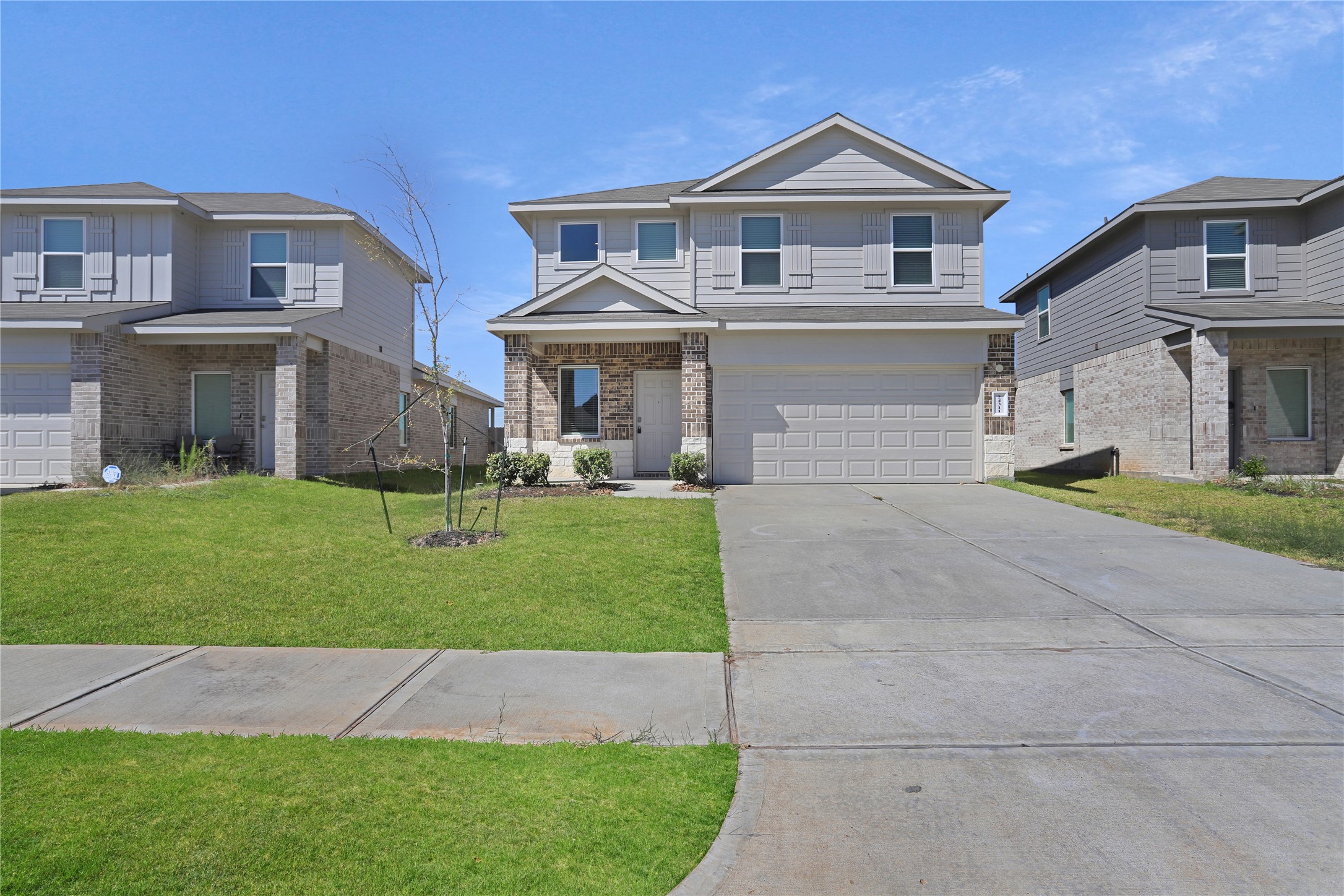 24311 Saddlestone Green Dr Spring Spring, TX 77373 - Photo 35 of 36 a front view of a house with a yard and garage