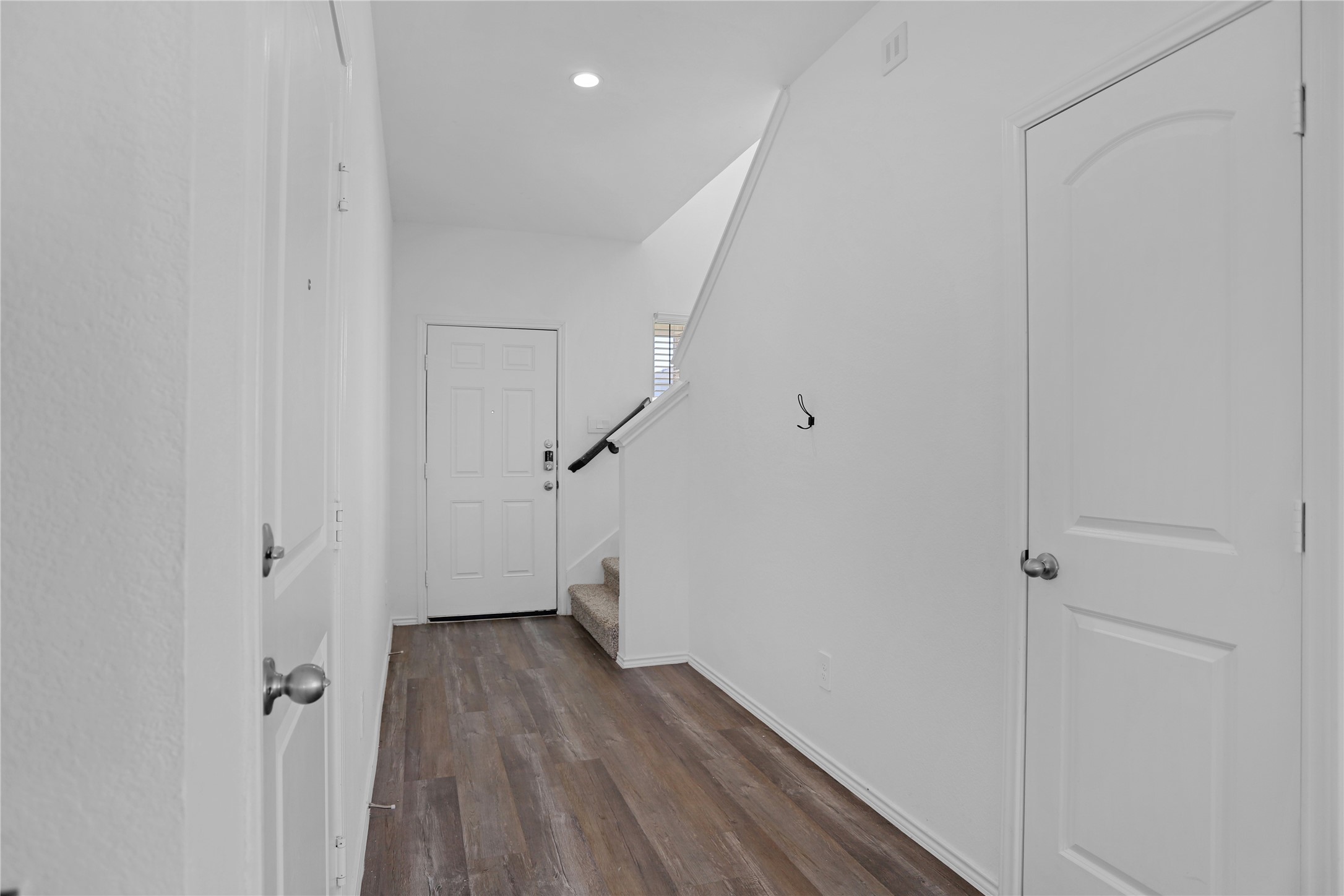 24311 Saddlestone Green Dr Spring Spring, TX 77373 - Photo 4 of 36 a view of a hallway with wooden floor and staircase