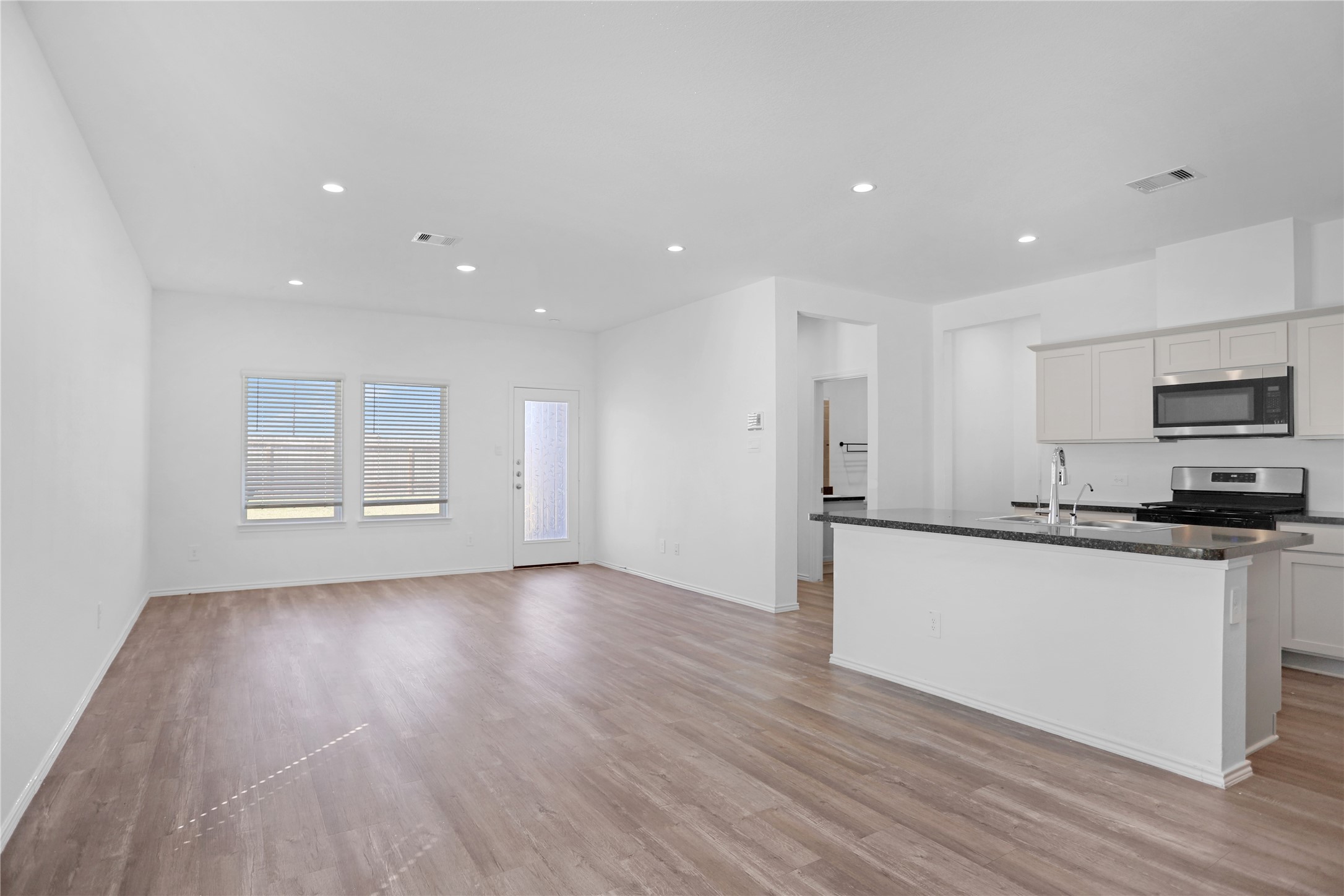 24311 Saddlestone Green Dr Spring Spring, TX 77373 - Photo 5 of 36 a kitchen with stainless steel appliances granite countertop a stove a sink and a refrigerator