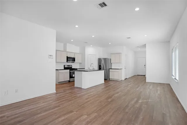a view of kitchen with wooden floor