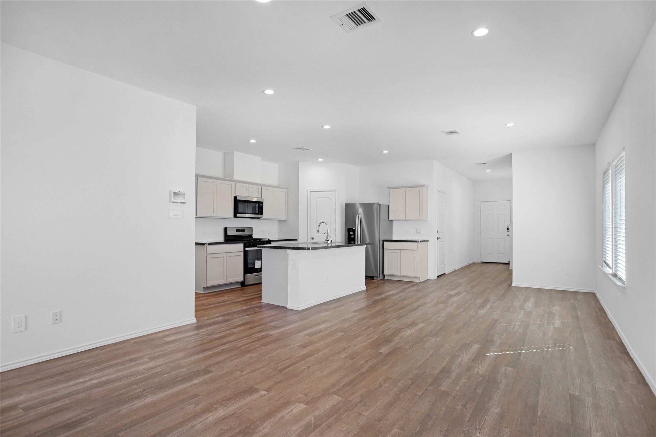 24311 Saddlestone Green Dr Spring Spring, TX 77373 - Photo 6 of 36 a view of kitchen with wooden floor