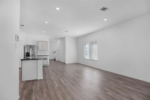 a view of kitchen with wooden floor
