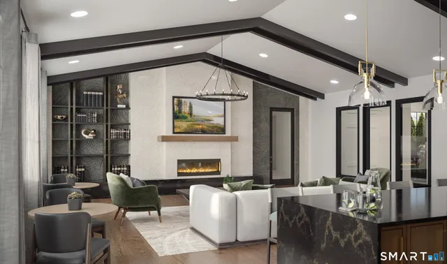 a living room with fireplace furniture and a large window