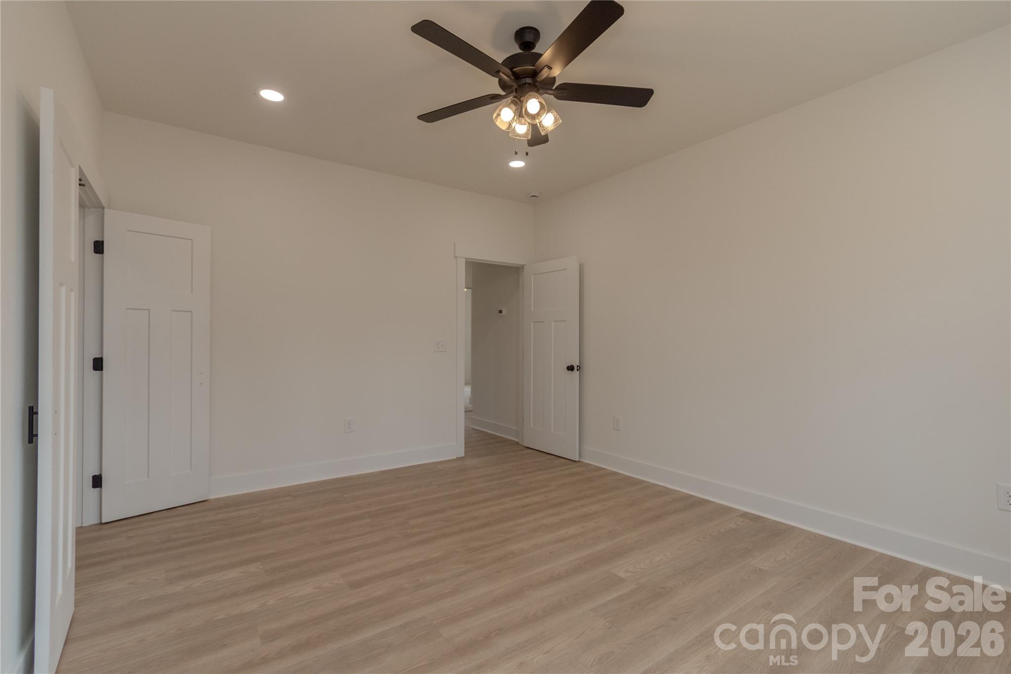 10303 Sycamore Road, Unit 90 Norwood, NC 28128 - Photo 22 of 42 wooden floor in an empty room