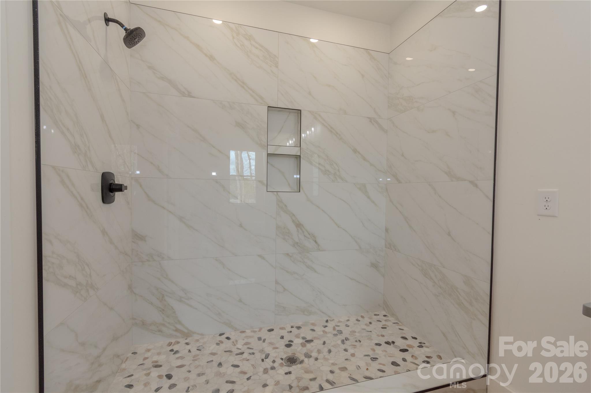 10303 Sycamore Road, Unit 90 Norwood, NC 28128 - Photo 28 of 42 a bathroom with a shower