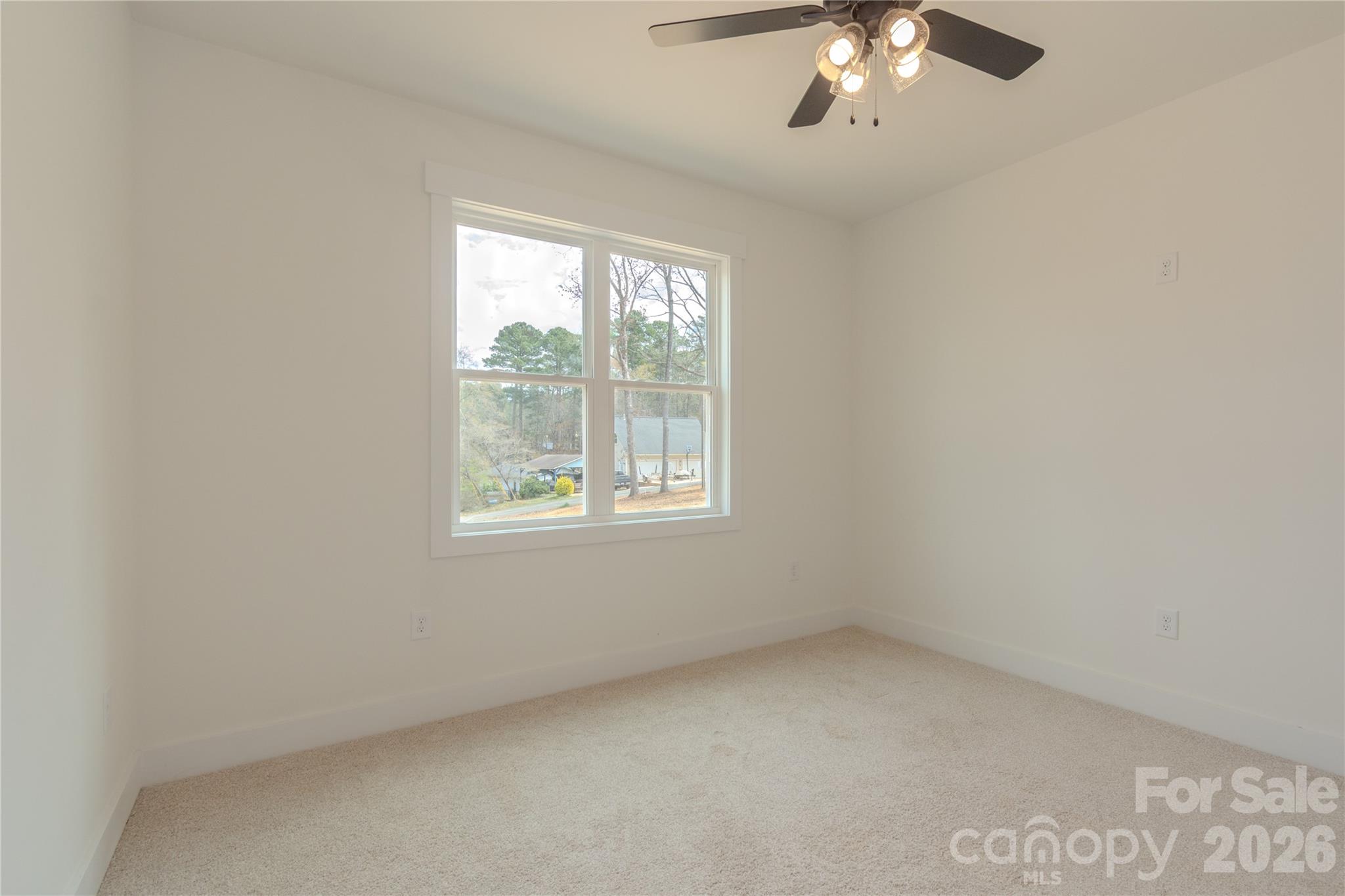10303 Sycamore Road, Unit 90 Norwood, NC 28128 - Photo 35 of 42 an empty room with a window