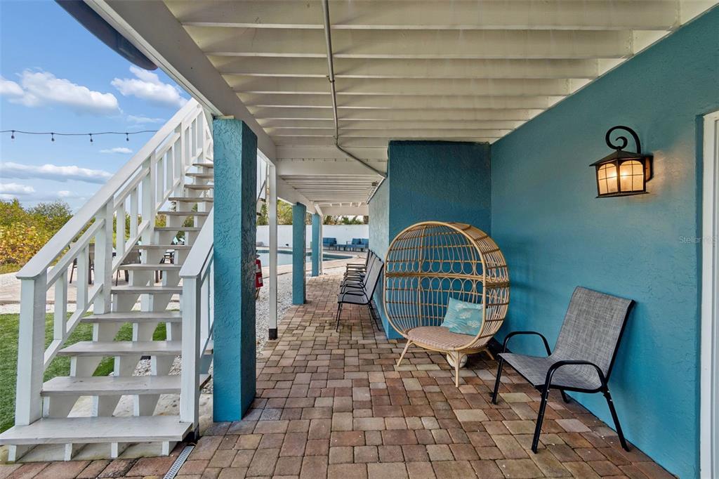 330 6th Avenue Indian Rocks Beach, FL 33785 - Photo 43 of 52 a view of a couches and a potted plant in a corridor