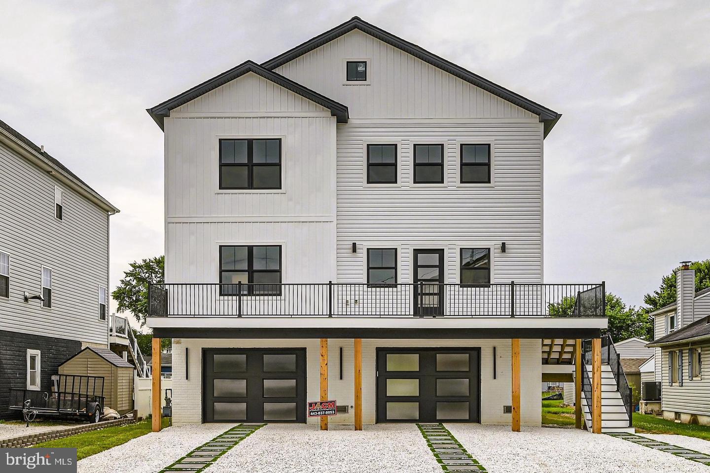 a front view of residential houses with yard