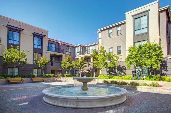 a view of a house with fountain bath tub and fire pit
