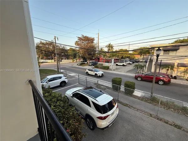 a view of a patio with a table and chairs